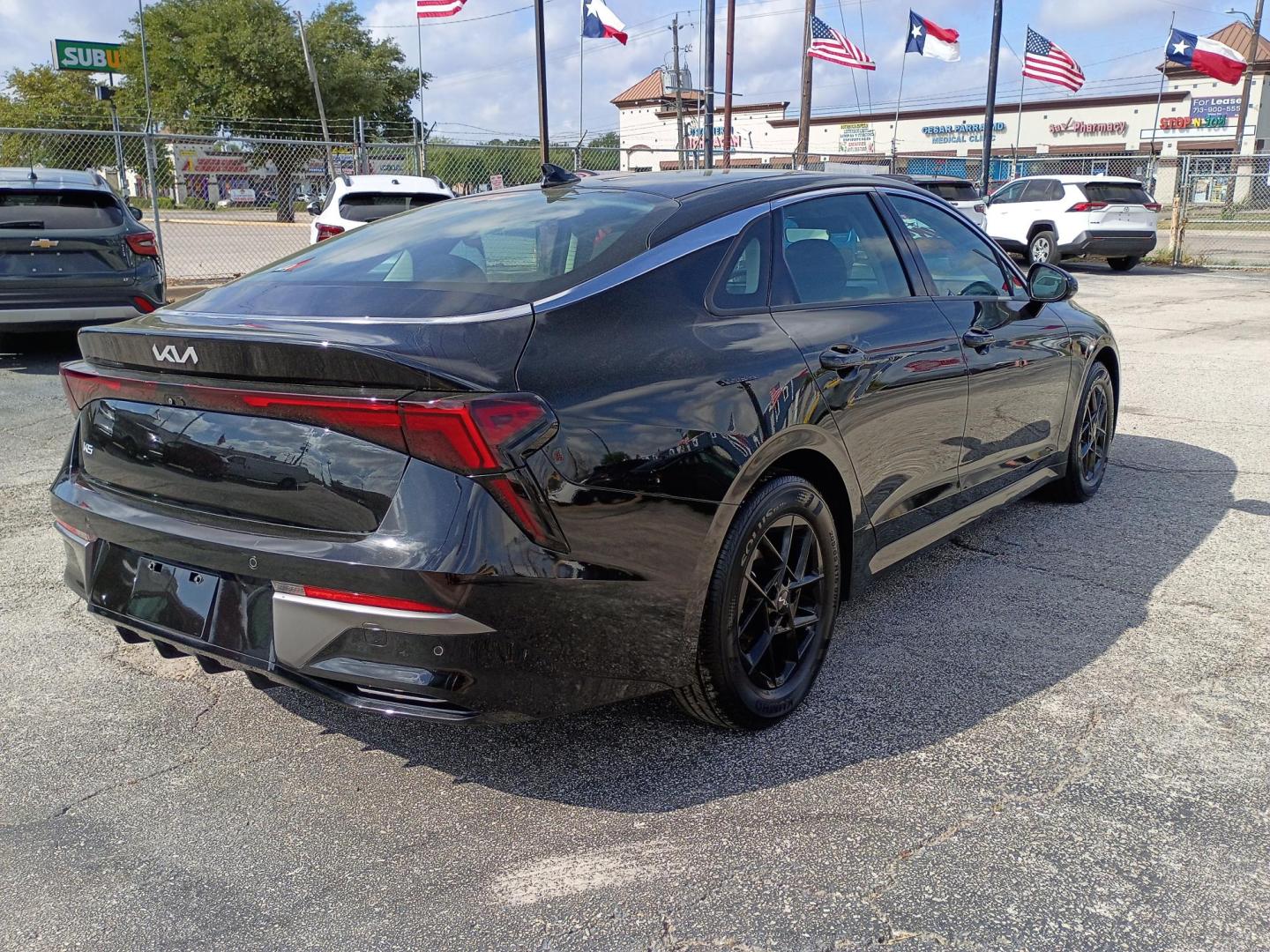 2025 Black /Black Kia K5 LXS (KNAG24J7XS5) with an 2.5L L4 DOHC 16V engine, 8A transmission, located at 1842 Wirt Road, Houston, TX, 77055, (713) 973-3903, 29.805330, -95.484787 - Photo#4