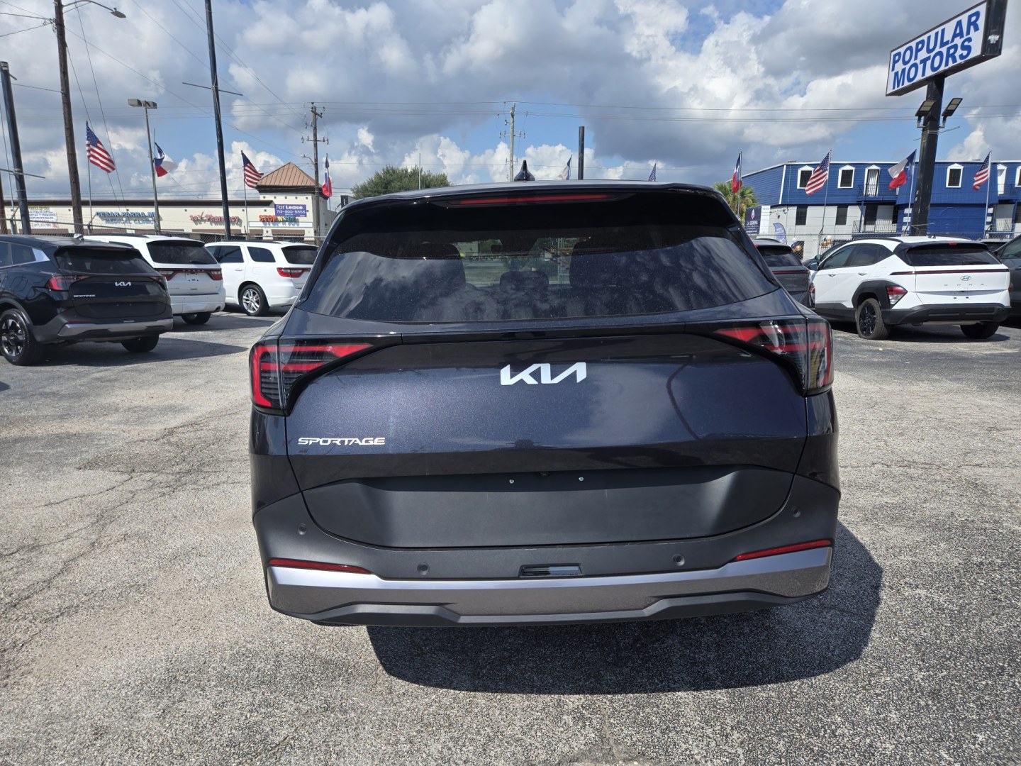 2026 Dark Gray /Black Kia Sportage LX (5XYK23DF8TG) with an 2.5L L4 DOHC 16V engine, 8A transmission, located at 1842 Wirt Road, Houston, TX, 77055, (713) 973-3903, 29.805330, -95.484787- Photo#3