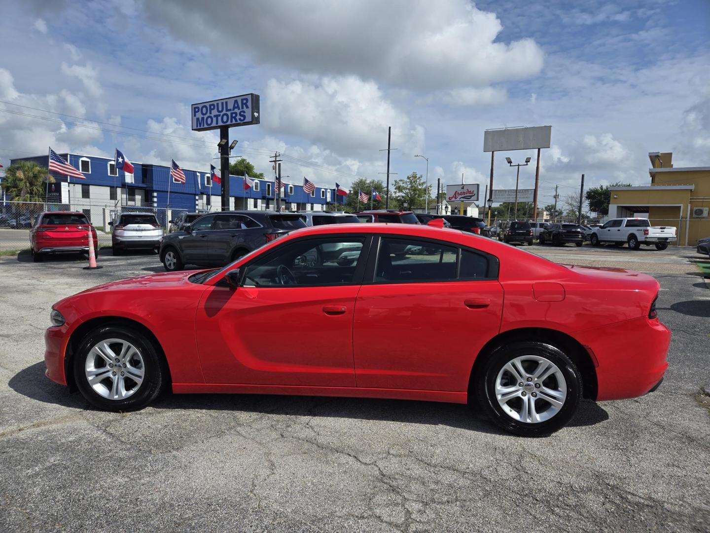 2023 Red /Black Dodge Charger SXT (2C3CDXBG1PH) with an 3.6L V6 DOHC 24V engine, 8A transmission, located at 1842 Wirt Road, Houston, TX, 77055, (713) 973-3903, 29.805330, -95.484787 - Photo#1