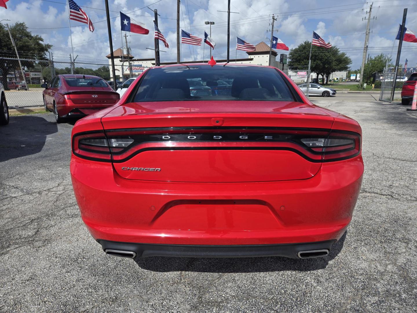 2023 Red /Black Dodge Charger SXT (2C3CDXBG1PH) with an 3.6L V6 DOHC 24V engine, 8A transmission, located at 1842 Wirt Road, Houston, TX, 77055, (713) 973-3903, 29.805330, -95.484787 - Photo#3